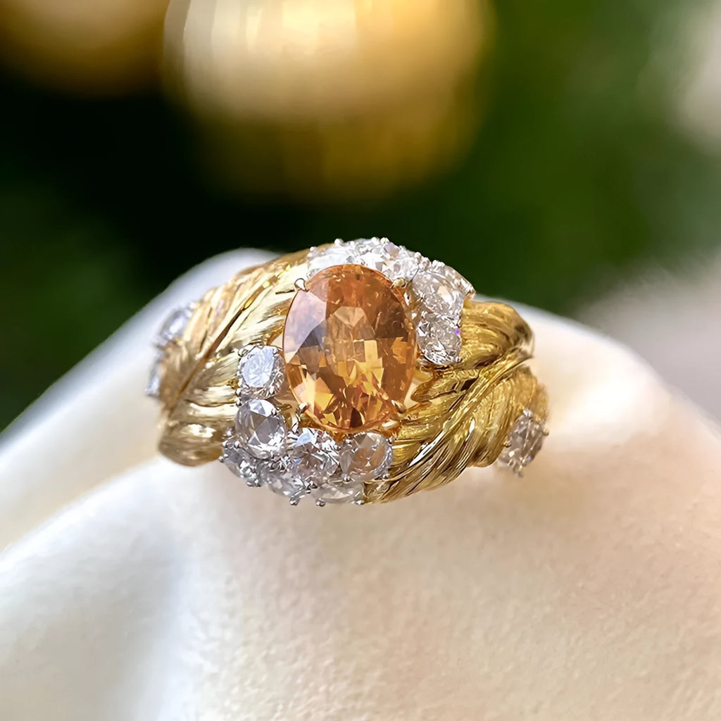 Gold colour feather embossed copper ring with yellow zircon stones in geometric design