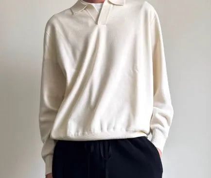 Pure wool polo neck sweater with lapel collar in loose fit, shown in milky white.