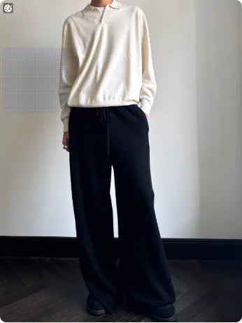 Pure wool polo neck sweater with lapel collar in loose fit, shown in milky white.