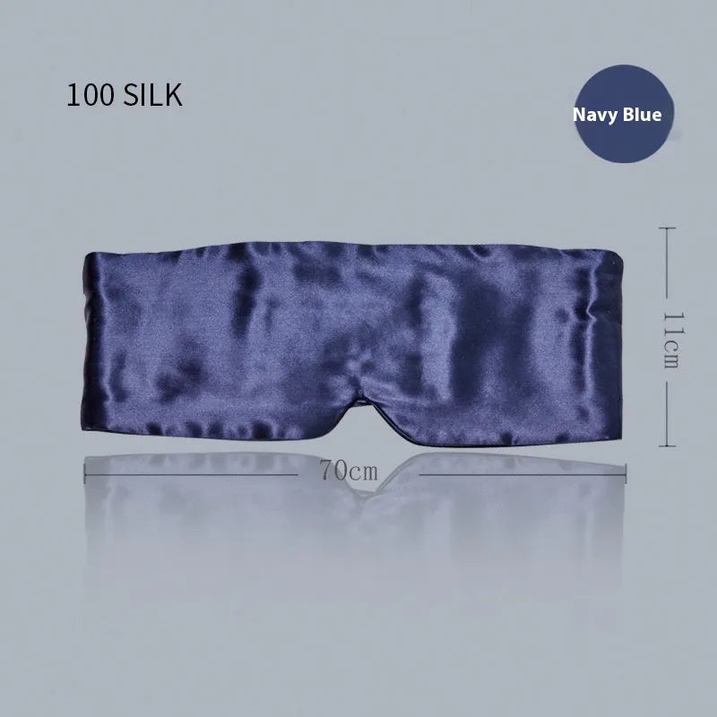 Mulberry silk sleep eye mask shown in champagne gold colour on a dark background.