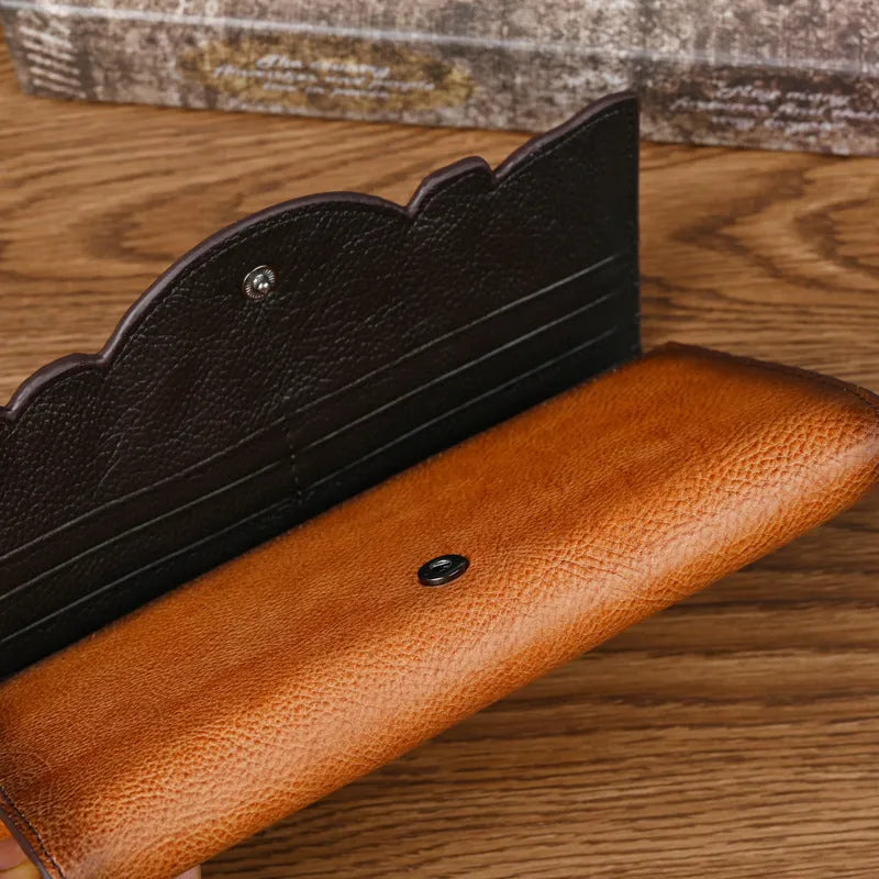 Chinese-style floral embossed women's leather wallet showing tri-fold design in retro brown colour