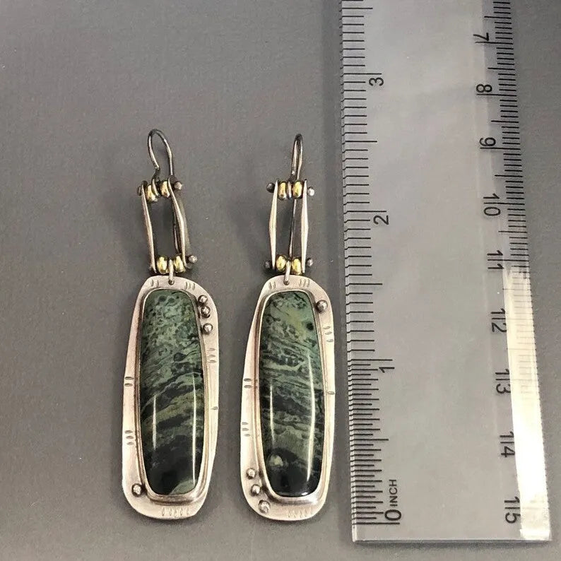 Geometric alloy earrings with two-colour marble pattern, showing angular shape and blended colour effect
