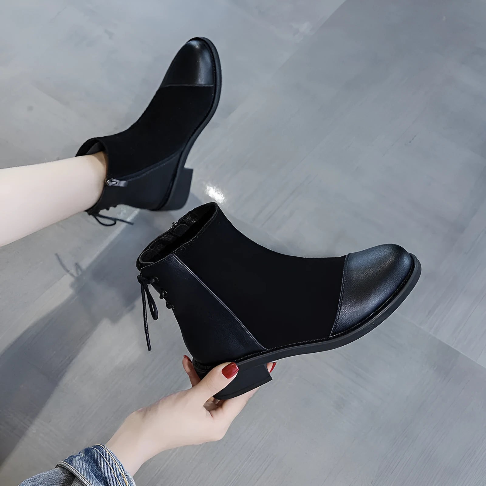 Women's black Martin boots with side zipper, round toe, and knee-length design