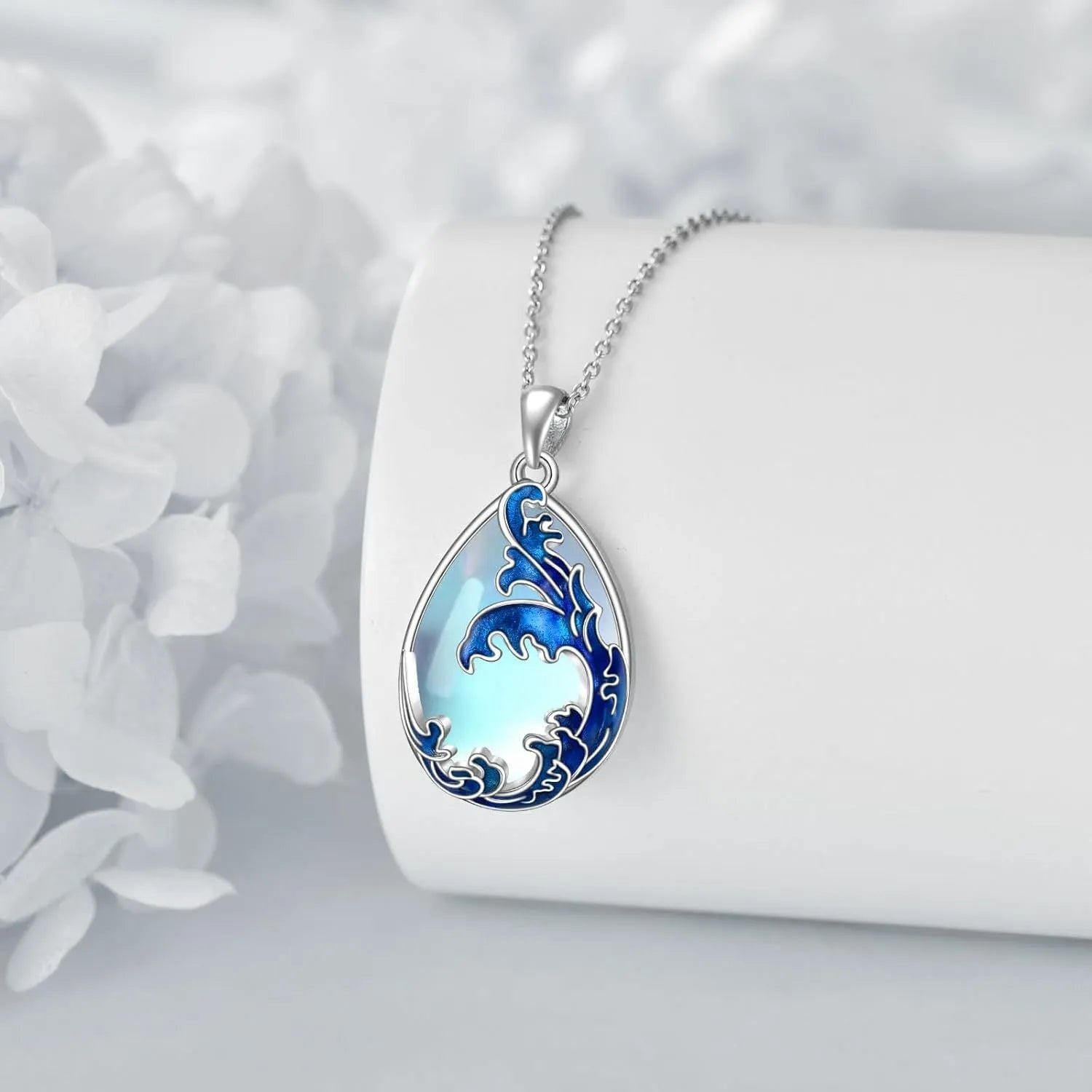 Blue heart-shaped alloy pendant necklace on a chain.