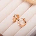Small rose gold hollowed-out leaf and heart shaped copper earrings
