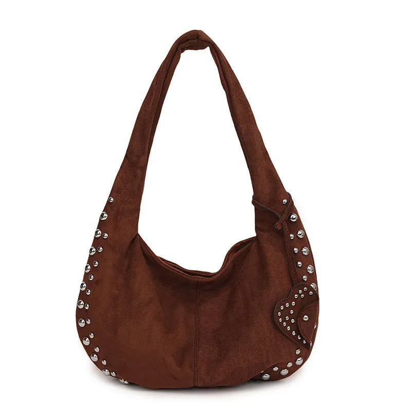 Soft plush retro style women's handbag in strapless tote design showing colour options