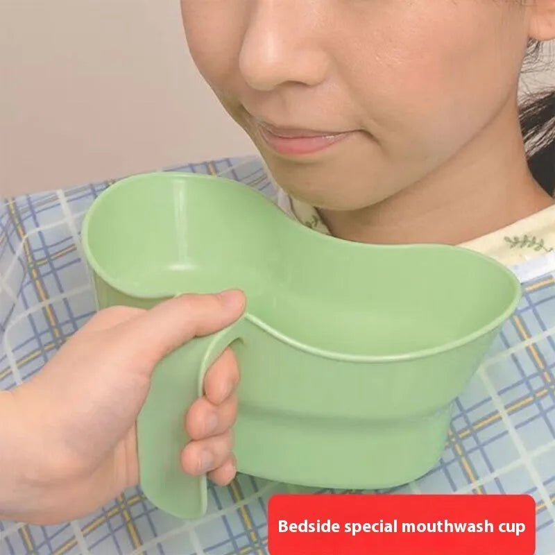Green plastic gargle cup with spout for bedridden patient oral care