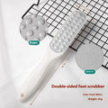 Stainless steel foot grinder tool with white and black double-sided abrasive files for callus removal.