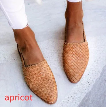 Pointed toe flat sandals with a buckle fastener on the upper, shown in a selection of colours.