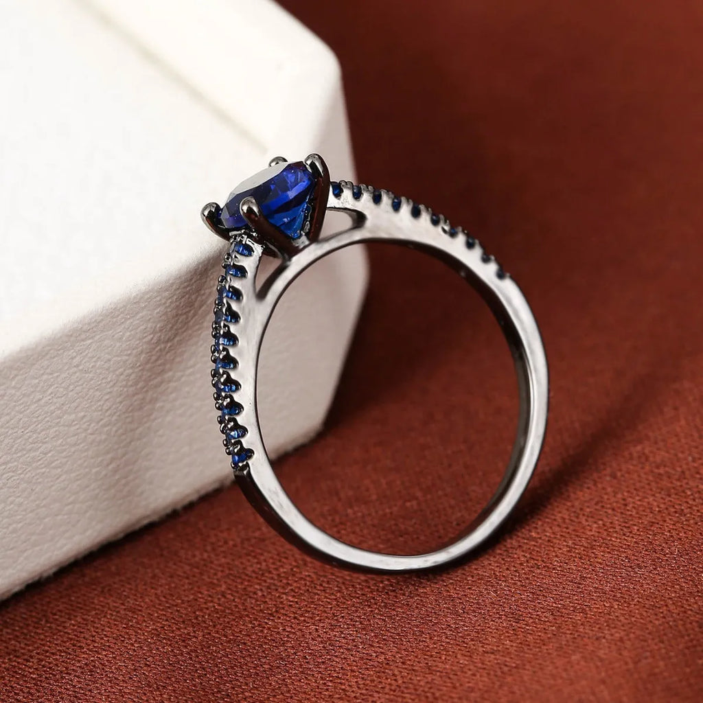 Geometric hexagon copper ring with colourful zircon stone in gun black finish.