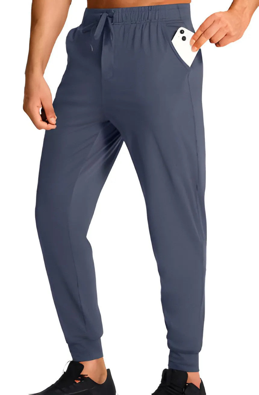 Men's loose-fit casual polyester trousers in a solid colour, shown in one of thirteen available colour codes.