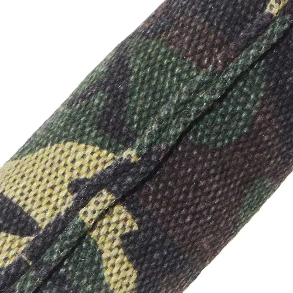 Beige jute dog tug toy with two fabric handles on a wooden floor