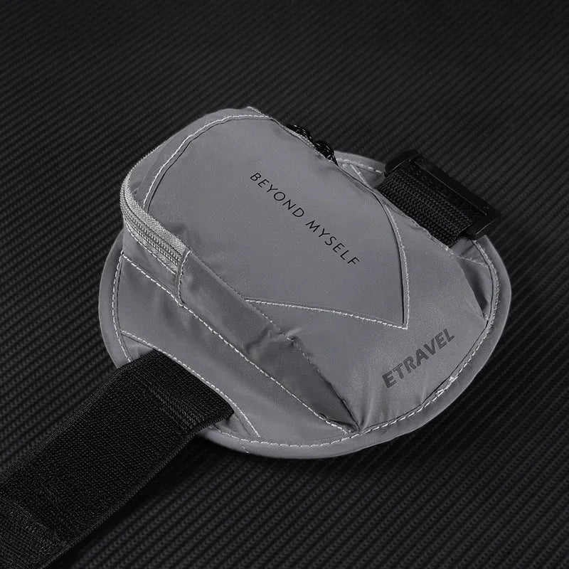 Black reflective running arm bag with adjustable strap and 7-inch capacity.
