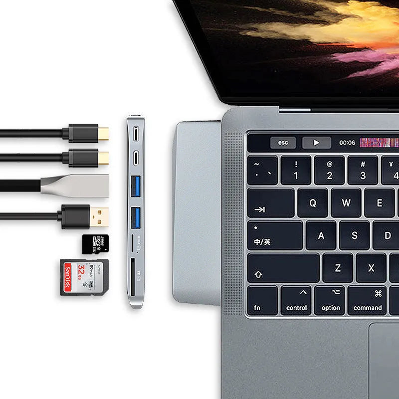 Silver 8-in-1 USB-C hub for MacBook Pro with dual connectors and multiple ports