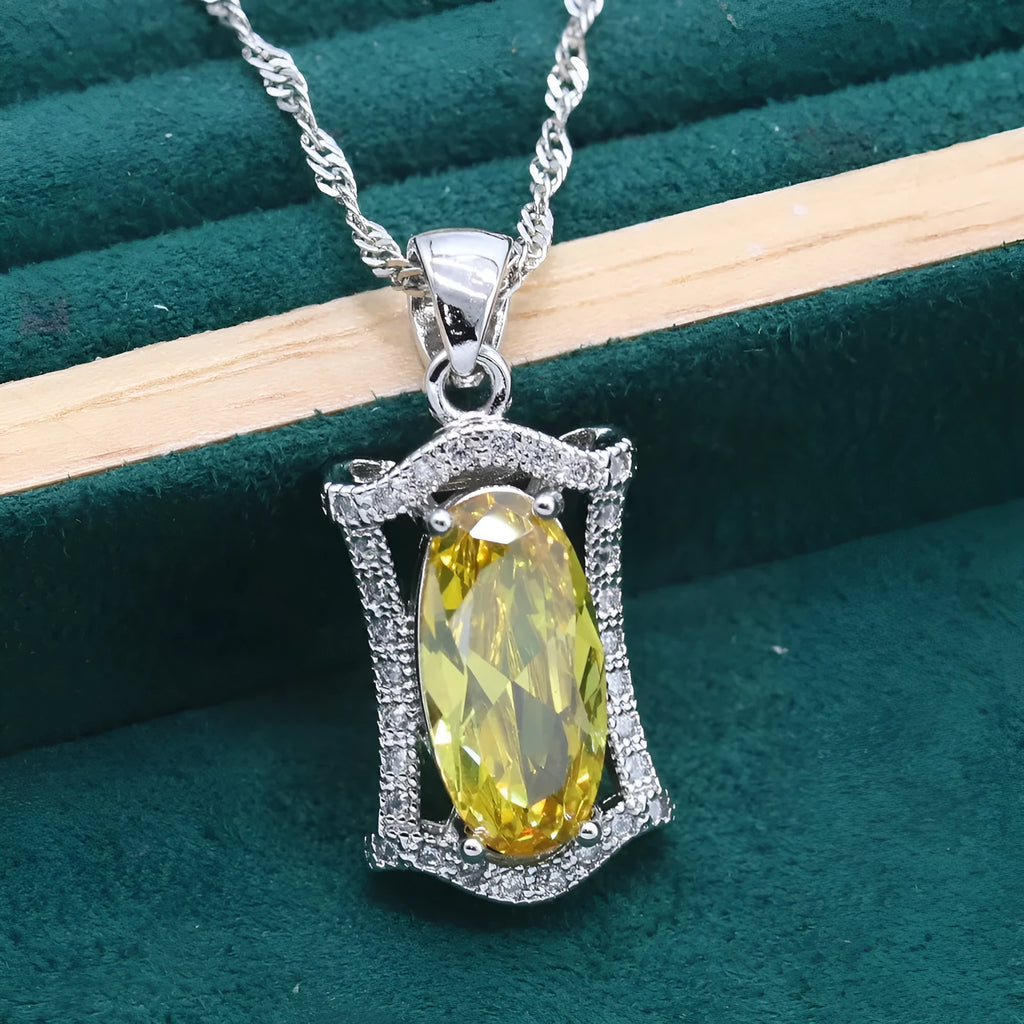 Women's olive yellow zirconia anti-allergy alloy jewellery set with necklace, earrings, ring, and bracelet.