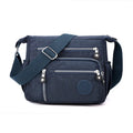 Nylon messenger bag with square vertical shape and single shoulder strap in available colours