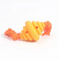 Green and yellow silicone dog ball with integrated rope, shown as a food-dispensing chew and tug toy.