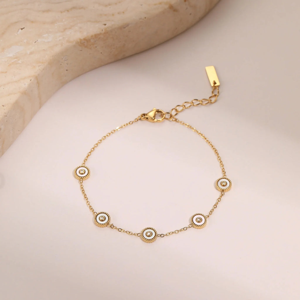 Stainless steel bracelet and necklace set with 18K gold plating and geometric fritillary design