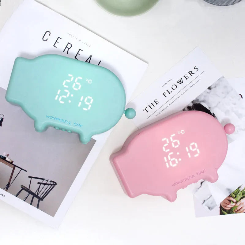 Blue multifunctional LED alarm clock showing time and temperature display with USB charging port