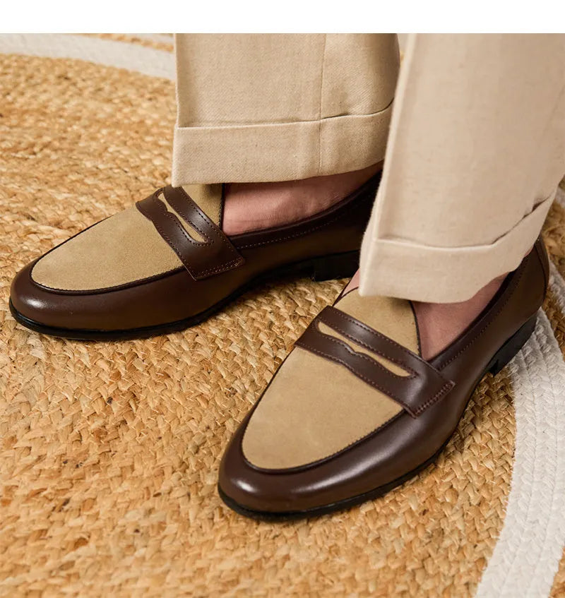 Coffee grey suede slip-on loafers with a rubber sole shown from the side.