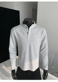Men's asymmetric patchwork long sleeve polo shirt with a stand-up collar in heather grey.