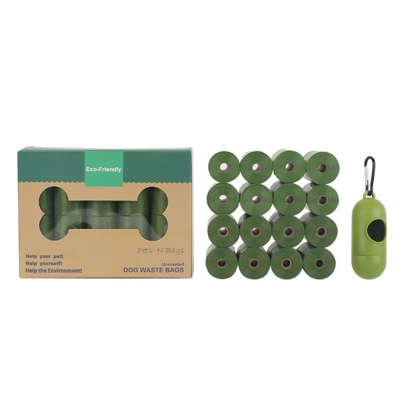 Roll of EPI degradable green dog poo bags next to a black portable dispenser on a green background.
