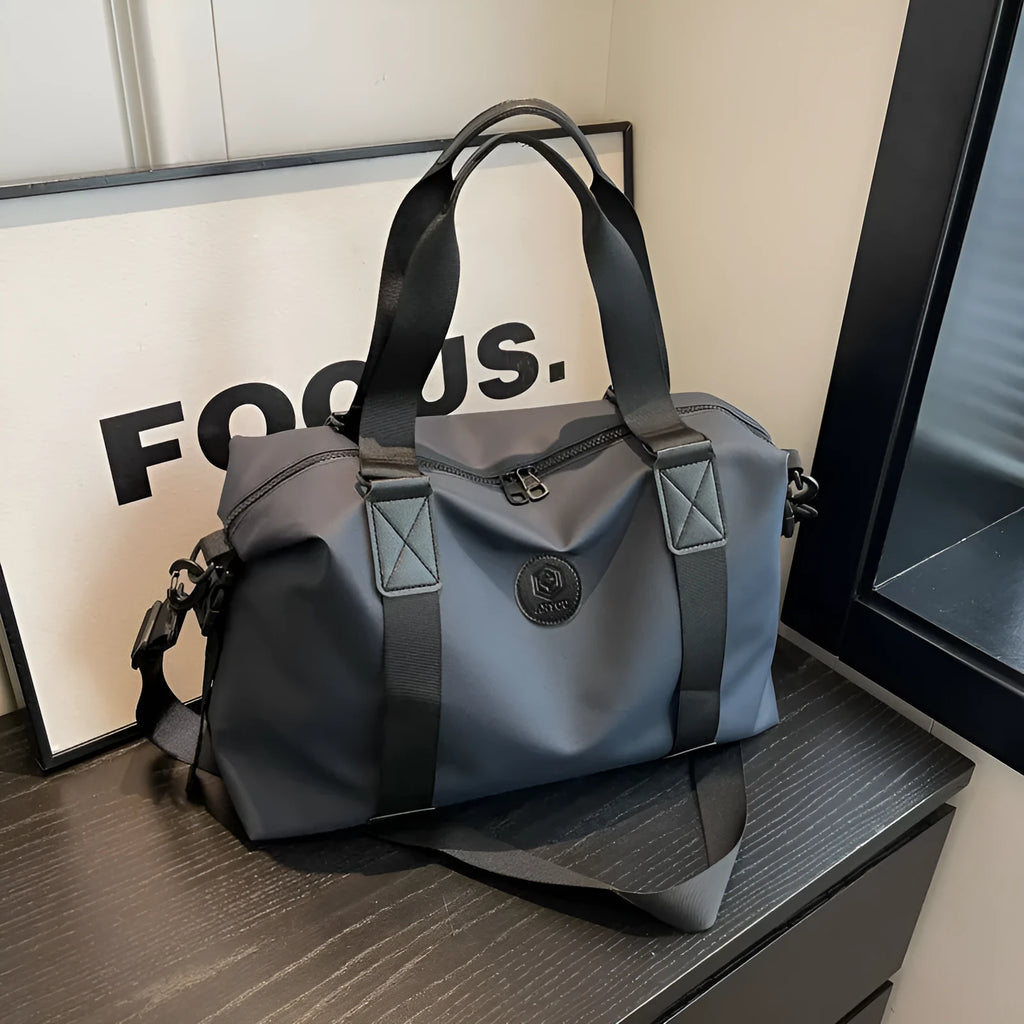 Waterproof Oxford cloth travel bag in solid colour with breathable back panel and 36-55L capacity