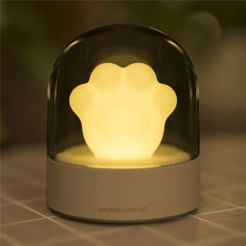 Grey or pink cat paw shaped USB rechargeable night light with music box and adjustable brightness levels