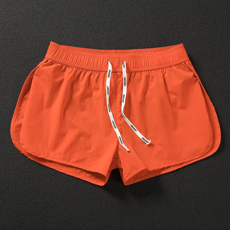 Men's loose beach shorts in orange red, fluorescent green and black colours with micro elasticity fabric