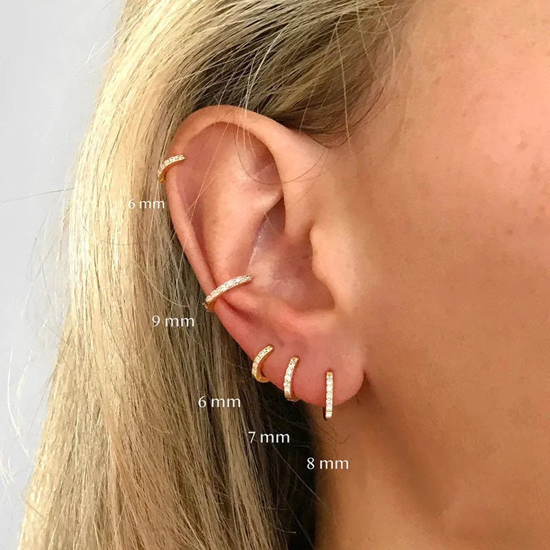 Women's circle zircon perforated stud earrings in gold, rose gold, and silver colour options showing geometric design