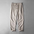 Men's linen casual trousers in navy blue, apricot, and grey colours with mid waist design