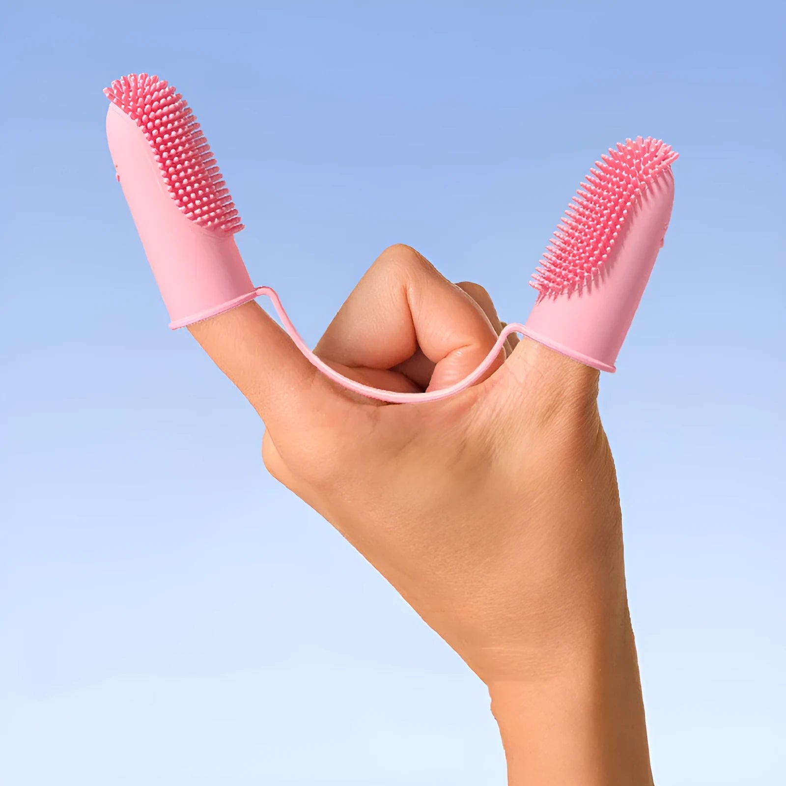 TPR pet dental cleaning finger set in pink, blue green, and yellow for dog and cat teeth.