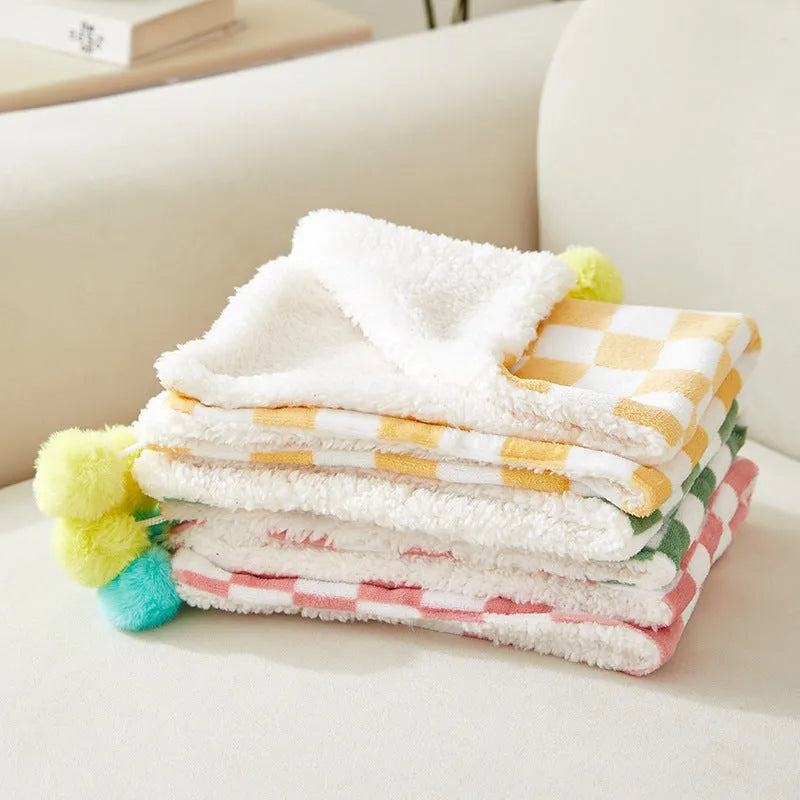 Green plaid pattern pet blanket with decorative fur balls for cats and dogs