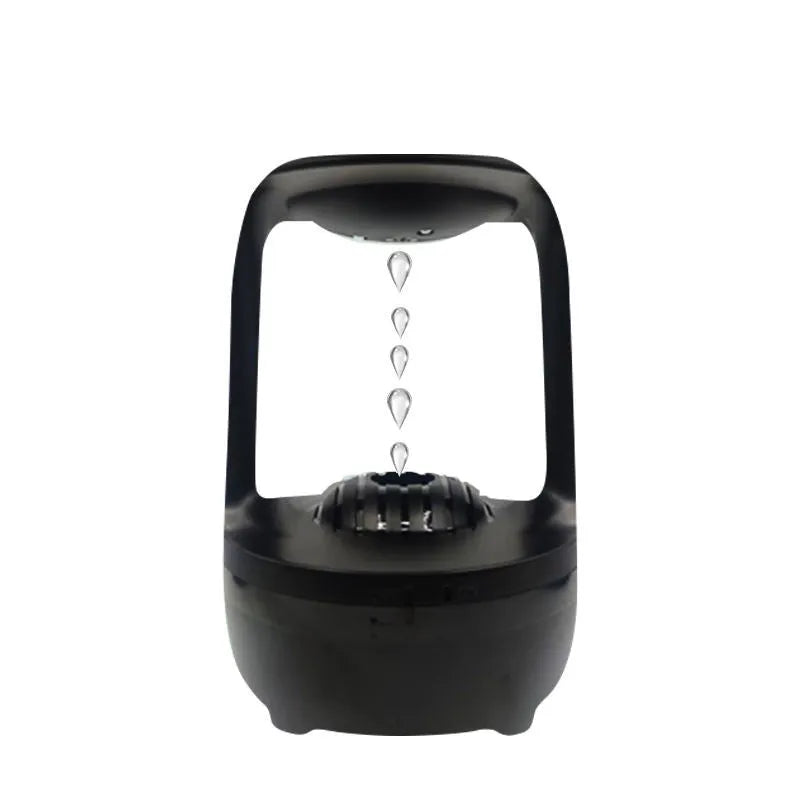 White anti-gravity water droplet humidifier with 500ml tank on a desk.
