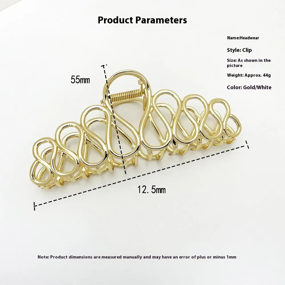 Minimalist large hair clip with electroplated alloy construction and tassel accents in gold or silver colour