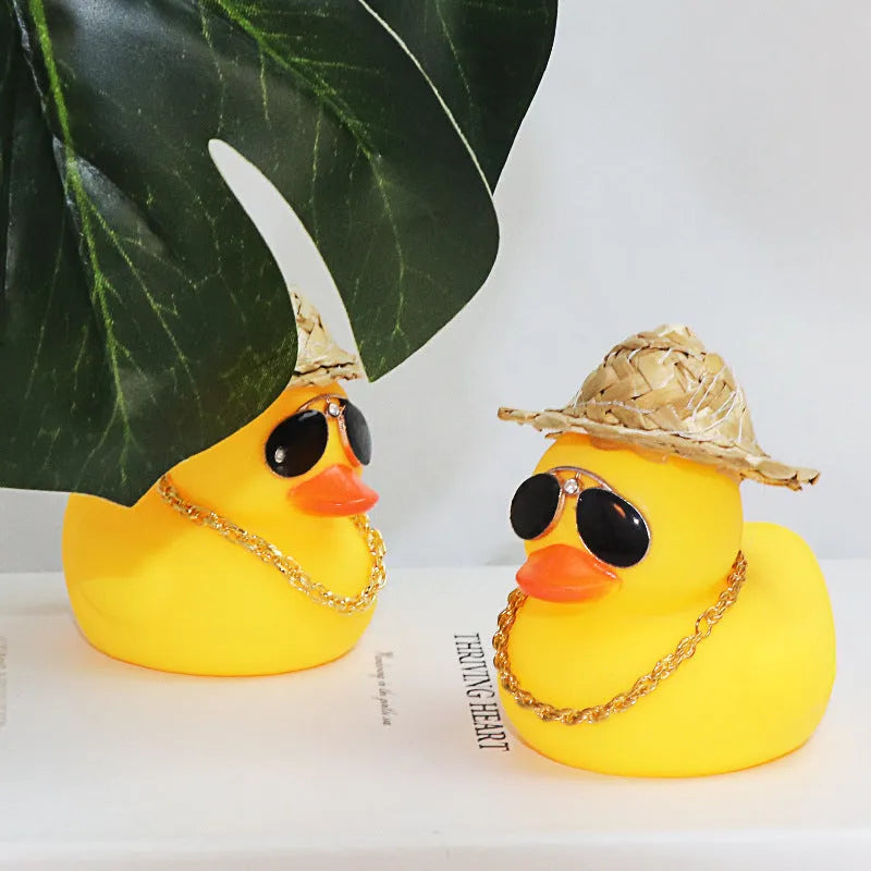 Yellow cartoon duck car ornament with straw hat and metal sunglasses for dashboard decoration