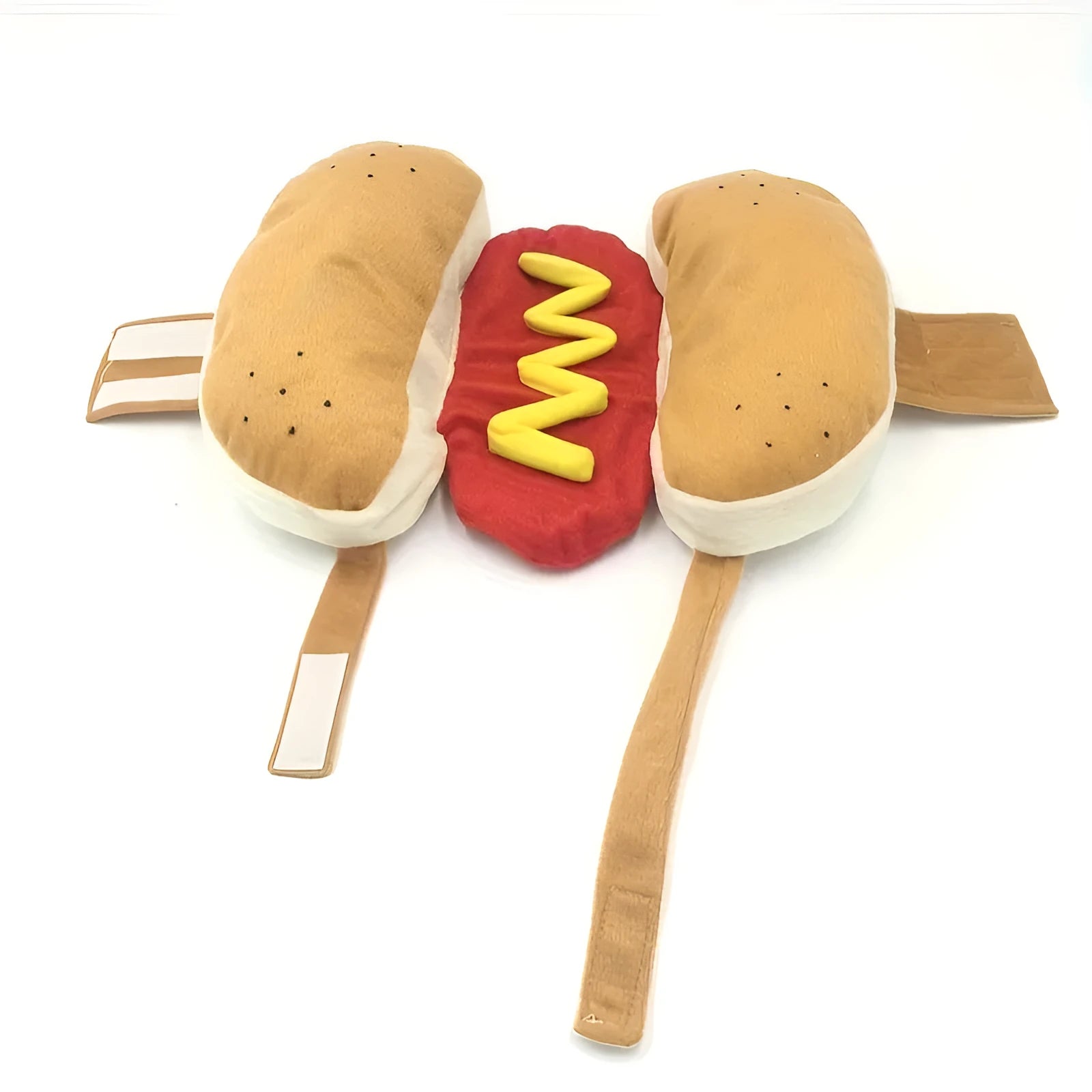A small dog wearing a soft, stuffed hot dog costume in a winter setting.