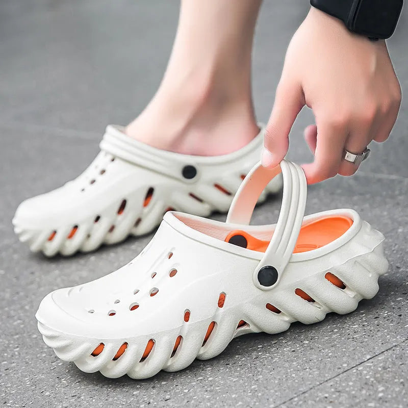 Men's beige hollow out EVA sandals with non-slip sole on a grey background.