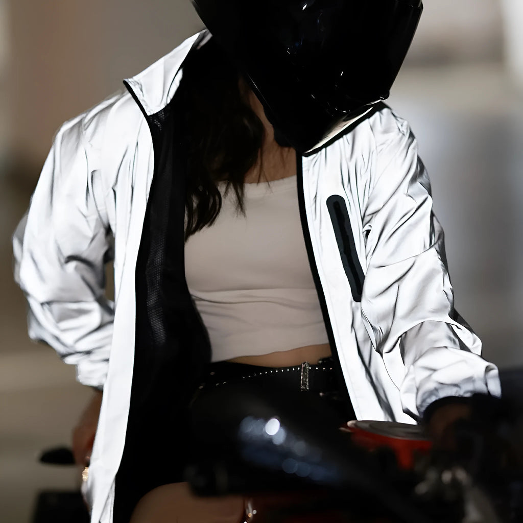 Silver waterproof polyester long sleeve top shown on a hanger.