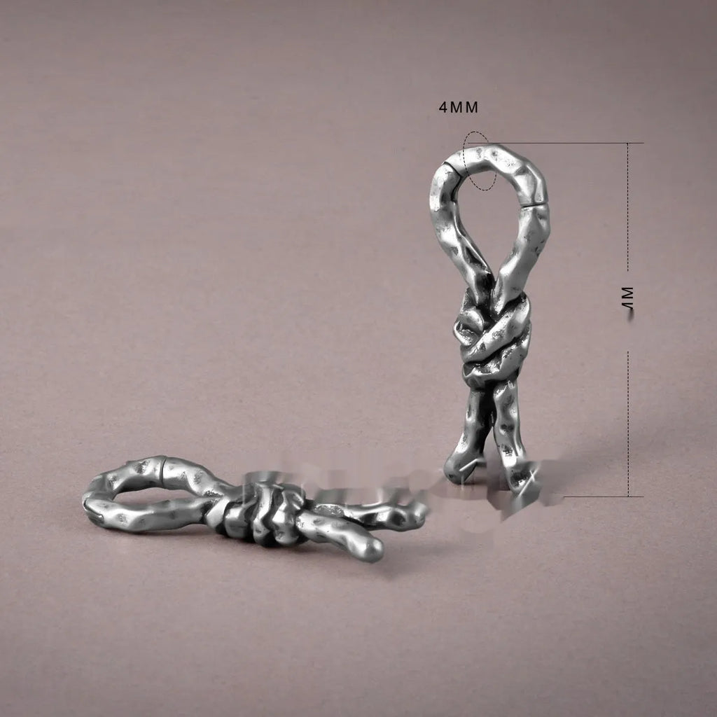 Close-up of 4mm copper bending and connecting earring for auricle piercing.