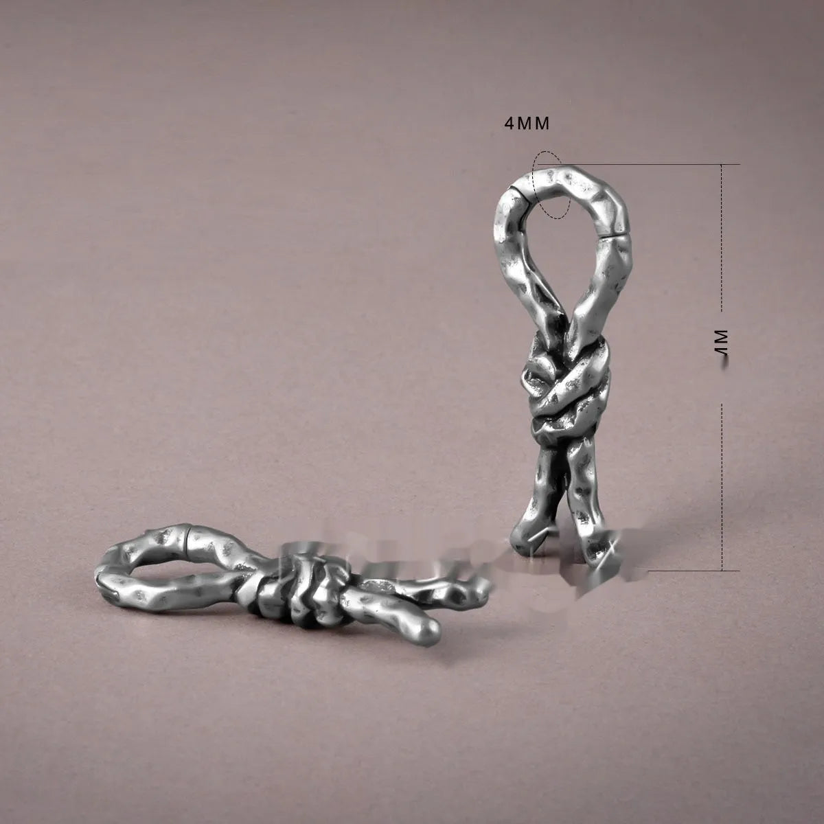 Close-up of 4mm copper bending and connecting earring for auricle piercing.