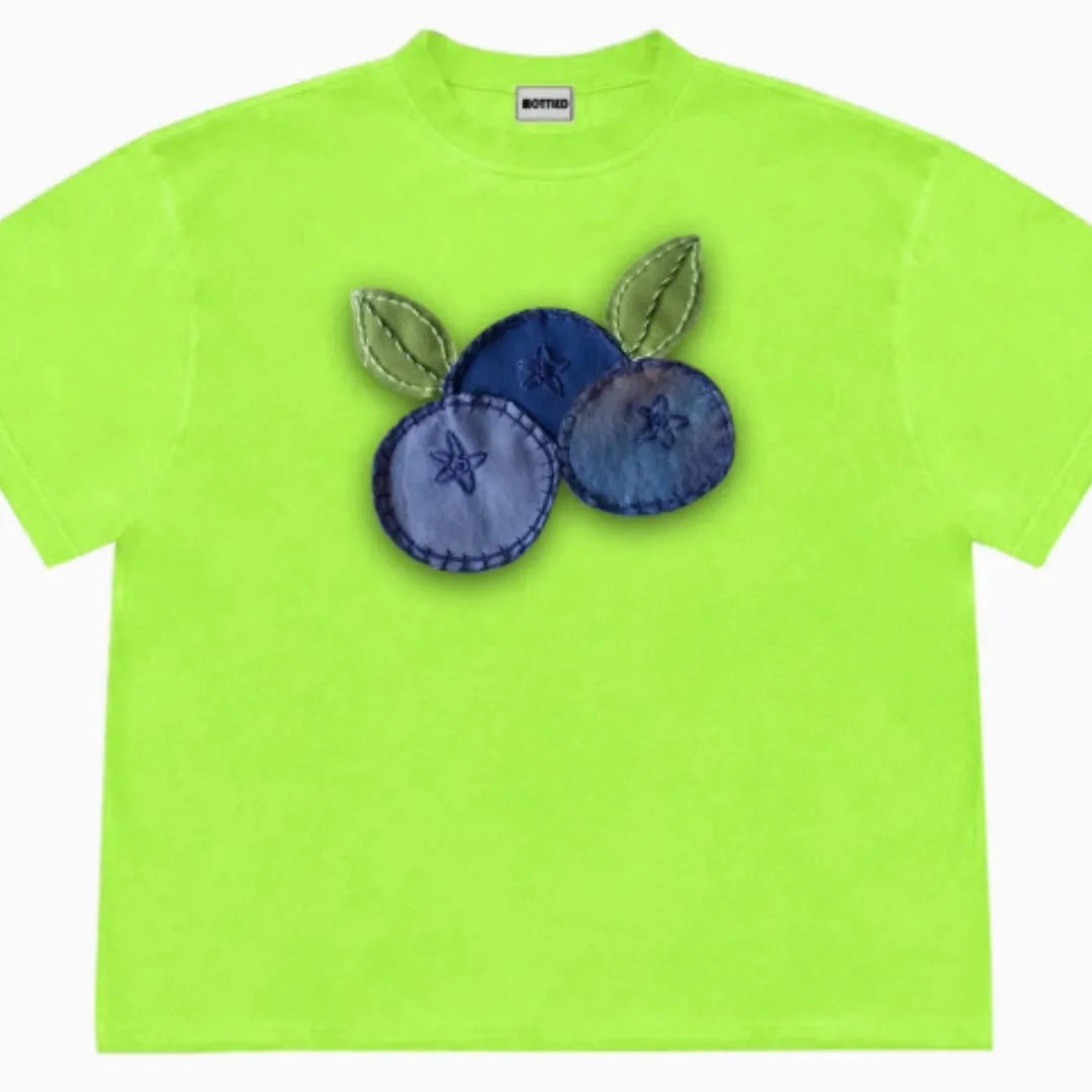 Blueberry and plant patchwork print on a women's loose-fit ice cotton t-shirt.