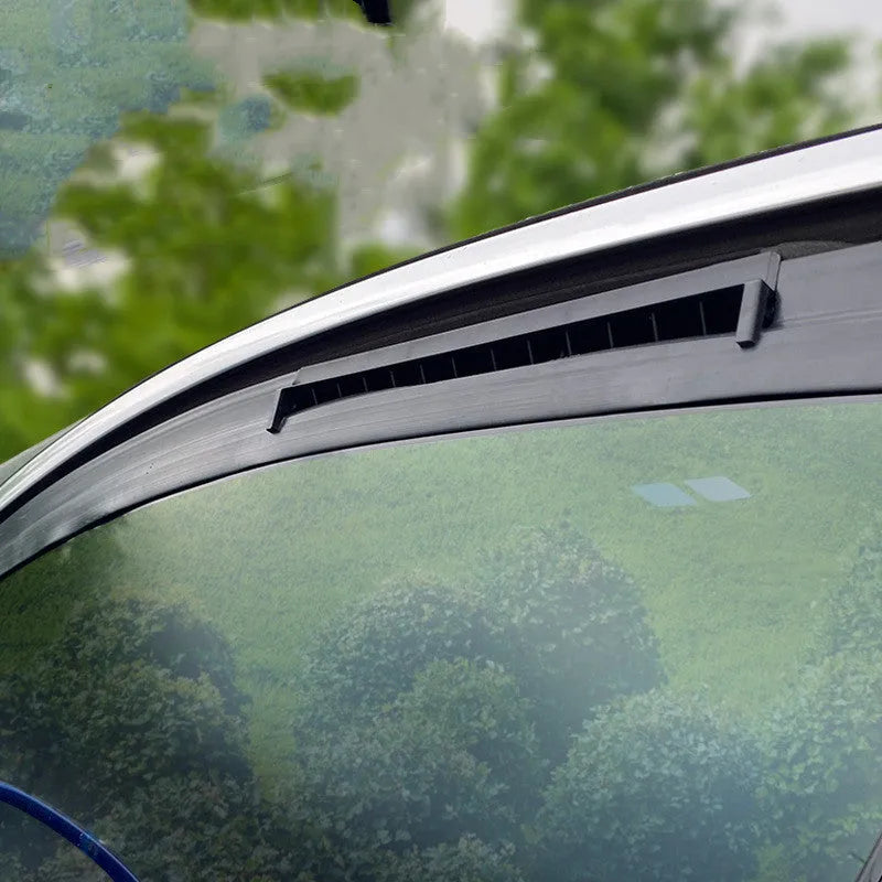 Black and white USB car ventilation fan with 1.5m cable on a car dashboard.