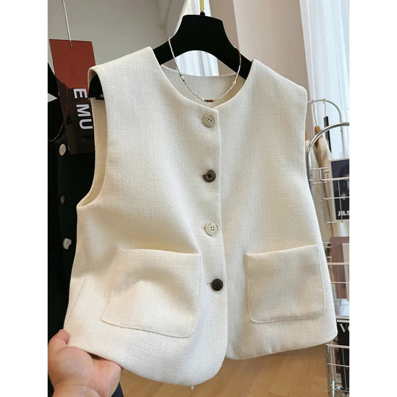 Women's French-style sleeveless bandage vest in beige, shown on a model, with a round neck and fitted silhouette.