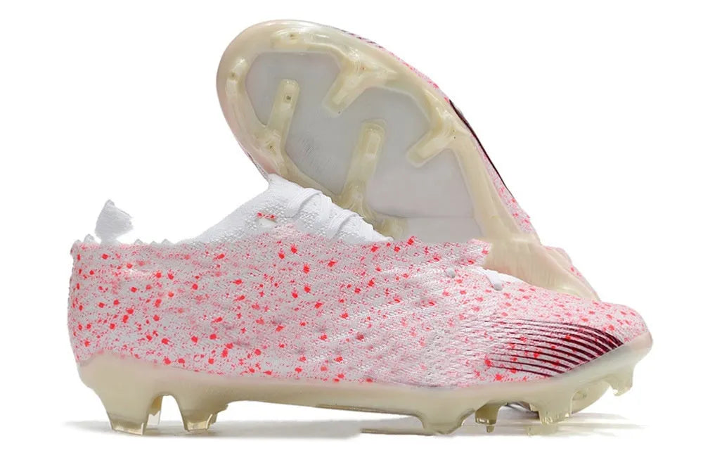 Men's low-top football shoes with knitted upper, air cushion, and FG studs on rubber outsole