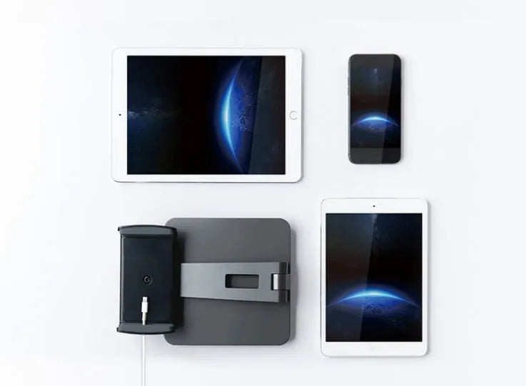 Black folding aluminium desktop stand holding a tablet at an angle, showing 360° rotation and silicone grips.