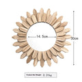 European rustic solid wood circular hanging mirror in baked colour on a wall.