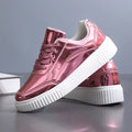 Rose gold and gold sequined platform sneakers with thick soles and round toe design