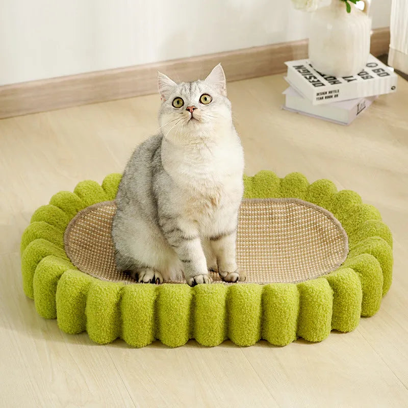 Green oval-shaped cat scratcher pad made of sisal, functioning as both a scratching surface and a lounge bed for cats.