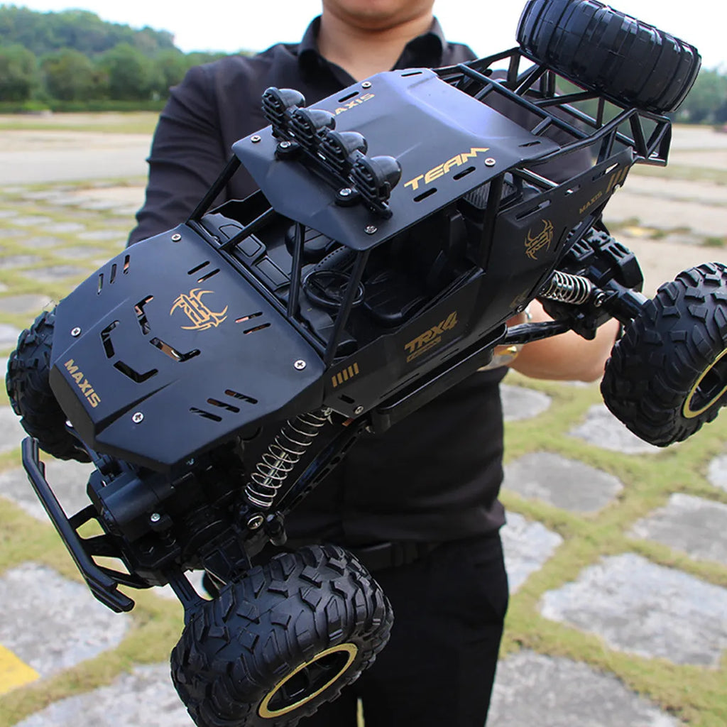 Black and silver 2.4G wireless remote control off-road cars in 28cm and 37cm sizes on rough terrain